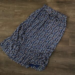 Skies are blue midi skirt
Blue, orangee, black and white
Worn 1 time